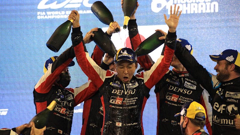Kazuki Nakajima celebrates at the FIA WEC season finale, the 8 Hours of Bahrain